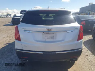 2019 Cadillac XT5 Premium Luxury AWD z VIN 1GYKNFRS5KZ252885, wystawiony jako Copart lot #49729865 z przebiegiem 54 593 mil mil oraz Szkoda całkowita • Salvage title. Historia ofert i sprzedaży dostępna na DreamBid. Obrazek 6.