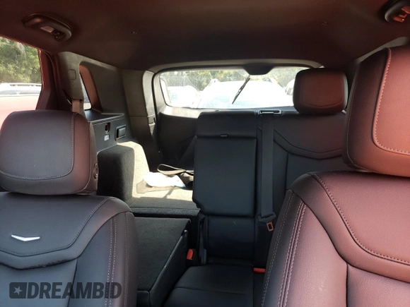 2023 Cadillac XT5 FWD Luxury z VIN 1GYKNAR4XPZ144533, wystawiony jako Copart lot #74734164 z przebiegiem Nie podano mil oraz Nie do naprawy • Non repairable. Historia ofert i sprzedaży dostępna na DreamBid. Obrazek 10.