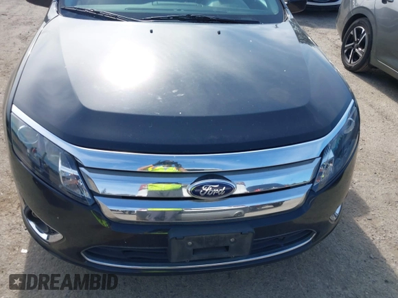 2012 Ford Fusion Hybrid z VIN 3FADP0L31CR380821, wystawiony jako IAAI lot #42332256 z przebiegiem 59 431 mil mil oraz . Historia ofert i sprzedaży dostępna na DreamBid. Obrazek 6.