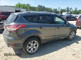 2015 Ford Escape Titanium with VIN 1FMCU9J92FUC74879, listed as a Copart auction lot 54683185 with 143,436 mi miles and Salvage title. Bid and sale history available at DreamBid. Image 3.