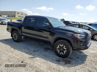 2023 Toyota Tacoma SR with VIN 3TMCZ5AN3PM571922, listed as a Copart auction lot 61872775 with 34,501 mi miles and Salvage title. Bid and sale history available at DreamBid. Image 4.