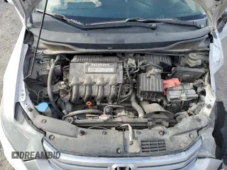 2010 Honda Insight EX z VIN JHMZE2H75AS007066, wystawiony jako Copart lot #54910995 z przebiegiem 107 658 mil mil oraz Szkoda całkowita • Salvage title. Historia ofert i sprzedaży dostępna na DreamBid. Obrazek 11.
