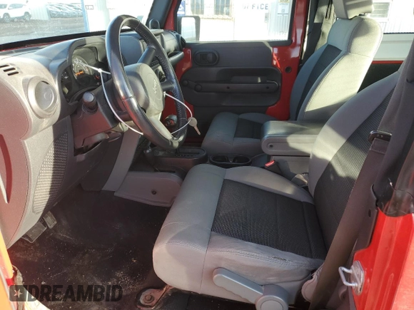 2009 Jeep Wrangler X with VIN 1J4FA24169L727333, listed as a Copart auction lot 47861445 with 70,343 mi miles and Salvage Title. Bid and sale history available at DreamBid. Image 7.