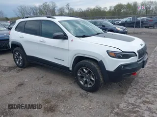 2019 Jeep Cherokee Trailhawk z VIN 1C4PJMBX7KD126848, wystawiony jako IAAI lot #42154124 z przebiegiem 94 248 mil mil oraz . Historia ofert i sprzedaży dostępna na DreamBid. Obrazek 1.