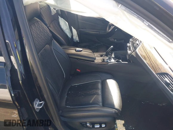 2019 BMW 5 Series M550i xDrive with VIN WBAJB9C51KB464879, listed as a IAAI auction lot 41774834 with 77,379 mi miles and . Bid and sale history available at DreamBid. Image 5.