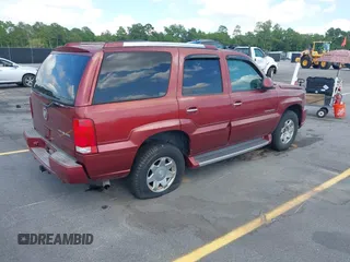 2003 Cadillac Escalade z VIN 1GYEK63N53R183593, wystawiony jako IAAI lot #42438258 z przebiegiem 74 561 mil mil oraz . Historia ofert i sprzedaży dostępna na DreamBid. Obrazek 4.
