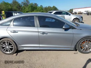 2015 Hyundai Sonata Sport z VIN 5NPE34AB4FH205255, wystawiony jako IAAI lot #42054966 z przebiegiem 201 526 mil mil oraz . Historia ofert i sprzedaży dostępna na DreamBid. Obrazek 13.