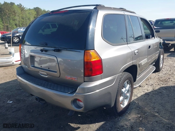 2005 GMC Envoy SLE with VIN 1GKDS13S452306939, listed as a IAAI auction lot 41931667 with 236,955 mi miles. Bid and sale history available at carsss.com. Image 4.