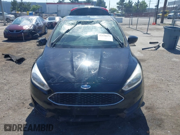 2018 Ford Focus SE z VIN 1FADP3FE9JL303933, wystawiony jako IAAI lot #42530171 z przebiegiem Nie podano mil oraz . Historia ofert i sprzedaży dostępna na DreamBid. Obrazek 11.