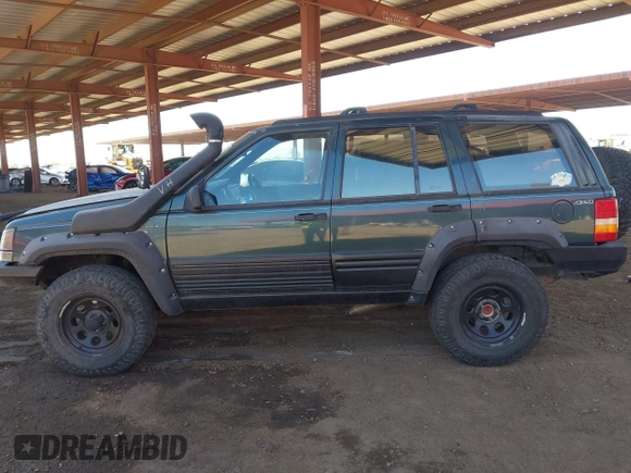 1994 Jeep Grand Cherokee Laredo with VIN 1J4GZ58S4RC280650, listed as a IAAI auction lot 42041261 with 199,265 mi miles and . Bid and sale history available at DreamBid. Image 14.
