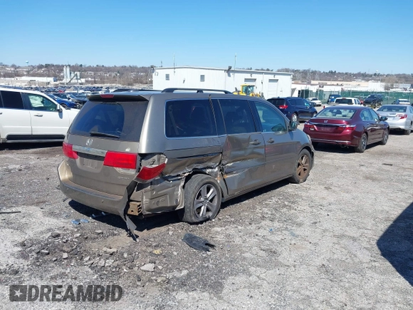 2010 Honda Odyssey Touring with VIN 5FNRL3H9XAB094765, listed as a IAAI auction lot 41892743 with 127,143 mi miles. Bid and sale history available at carsss.com. Image 4.