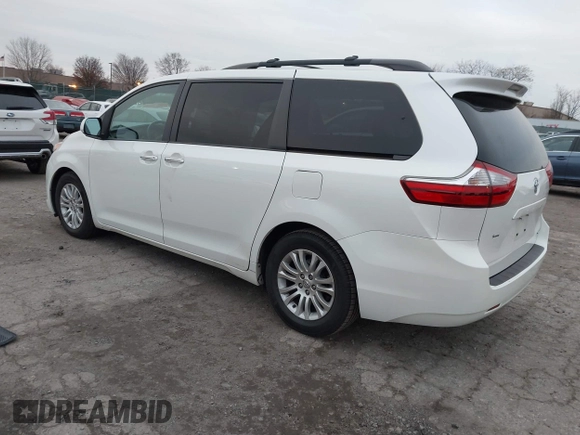2015 Toyota Sienna XLE with VIN 5TDYK3DC9FS595827, listed as a IAAI auction lot 41014820 with 119,143 mi miles. Bid and sale history available at carsss.com. Image 3.