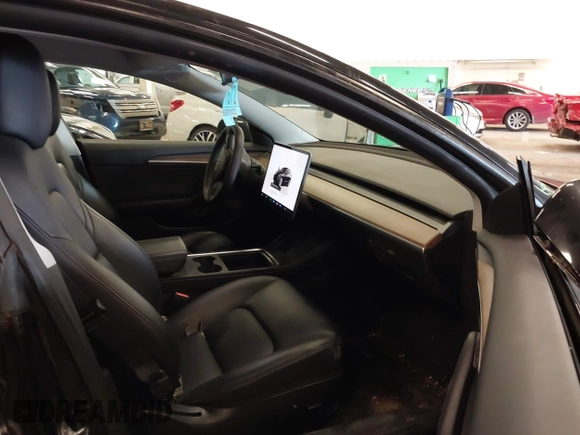 2022 Tesla Model 3 with VIN 5YJ3E1EA4NF187113, listed as a IAAI auction lot 41712331 with 81,879 mi miles and . Bid and sale history available at DreamBid. Image 5.