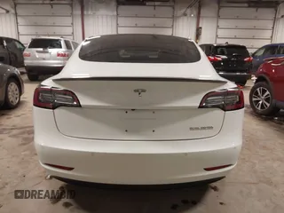 2018 Tesla Model 3 Long Range Battery with VIN 5YJ3E1EB5JF084446, listed as a IAAI auction lot 41209852 with 70,125 mi miles and . Bid and sale history available at DreamBid. Image 17.