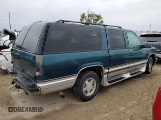 1996 GMC Suburban z VIN 1GKEC16R2TJ714191, wystawiony jako Copart lot #74660264 z przebiegiem 186 801 mil mil oraz Szkody całkowita. Historia ofert i sprzedaży dostępna na DreamBid. Obrazek 3.