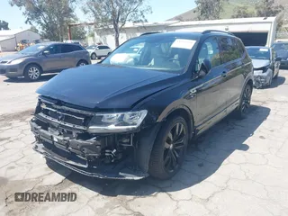 2021 Volkswagen Tiguan SE with VIN 3VV3B7AX0MM015825, listed as a IAAI auction lot 41955268 with 57,909 mi miles and . Bid and sale history available at DreamBid. Image 20.