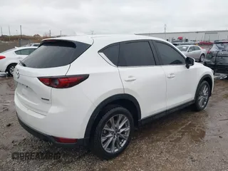 2021 Mazda CX-5 Grand Touring with VIN JM3KFADM4M1340141, listed as a IAAI auction lot 41194711 with 37,887 mi miles. Bid and sale history available at carsss.com. Image 4.