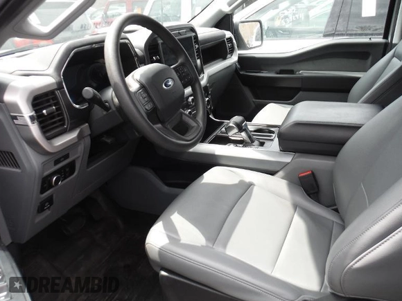 2023 Ford F-150 Lightning Pro with VIN 1FTVW1EL4PWG02842, listed as a IAAI auction lot 42240052 with 48,752 mi miles and . Bid and sale history available at DreamBid. Image 1.