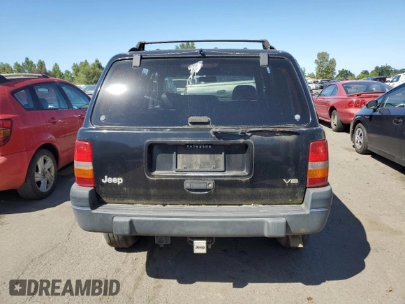 1998 Jeep Grand Cherokee Laredo with VIN 1J4GZ58Y4WC109610, listed as a Copart auction lot 58705124 with 247,990 mi miles and Salvage Title. Bid and sale history available at carsss.com. Image 6.