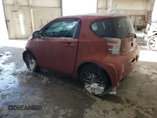 2015 Scion iQ with VIN JTNJJXB09FJ030667, listed as a Copart auction lot 87321594 with 124,895 mi miles and Salvage Title. Bid and sale history available at carsss.com. Image 2.