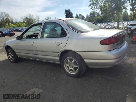 1998 Ford Contour LX with VIN 1FAFP66L2WK290948, listed as a Copart auction lot 56204295 with 76,307 mi miles and Salvage title. Bid and sale history available at DreamBid. Image 2.