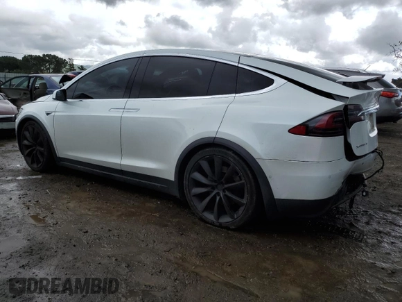 2016 Tesla Model X 70D with VIN 5YJXCAE28GF017100, listed as a Copart auction lot 50081235 with 126,962 mi miles and Salvage Title. Bid and sale history available at DreamBid. Image 2.