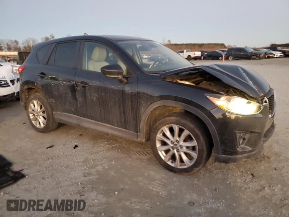 2014 Mazda CX-5 Grand Touring with VIN JM3KE4DY9E0366667, listed as a Copart auction lot 88707365 with 140,115 mi miles and Salvage Title. Bid and sale history available at carsss.com. Image 4.