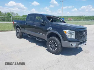 2017 Nissan Titan Platinum Reserve z VIN 1N6AA1F43HN502787, wystawiony jako IAAI lot #42212526 z przebiegiem 158 876 mil mil oraz . Historia ofert i sprzedaży dostępna na DreamBid. Obrazek 1.