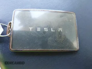 2019 Tesla Model 3 Mid Range with VIN 5YJ3E1EA5KF327181, listed as a IAAI auction lot 41860943 with 157,335 mi miles and . Bid and sale history available at DreamBid. Image 11.