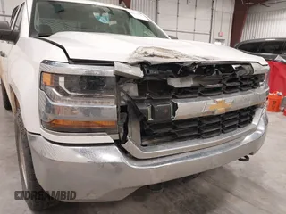 2016 Chevrolet Silverado 1500 LS with VIN 1GCVKNEC9GZ278143, listed as a IAAI auction lot 42131591 with 214,440 mi miles and . Bid and sale history available at DreamBid. Image 6.