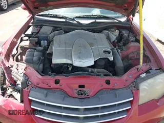 2005 Chrysler Crossfire Limited z VIN 1C3AN65L65X057205, wystawiony jako IAAI lot #41878855 z przebiegiem 209 199 mil mil oraz . Historia ofert i sprzedaży dostępna na DreamBid. Obrazek 10.