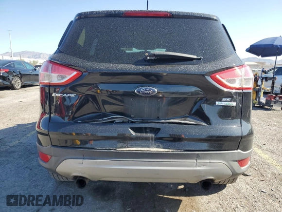 2013 Ford Escape SE with VIN 1FMCU0GX8DUA38056, listed as a Copart auction lot 57617885 with 128,467 mi miles and Salvage title. Bid and sale history available at DreamBid. Image 6.