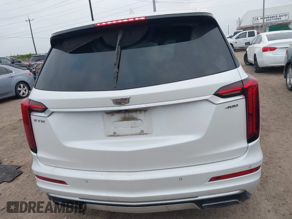2020 Cadillac XT6 FWD Premium Luxury with VIN 1GYKPCRS2LZ101061, listed as a IAAI auction lot 42113360 with Not provided miles and . Bid and sale history available at DreamBid. Image 16.