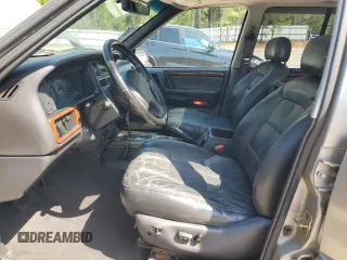 1998 Jeep Grand Cherokee Limited with VIN 1J4GZ78YXWC160346, listed as a Copart auction lot 52595655 with Not provided miles and Salvage title. Bid and sale history available at DreamBid. Image 7.