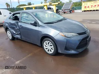 2018 Toyota Corolla L z VIN 5YFBURHE9JP760873, wystawiony jako IAAI lot #41382386 z przebiegiem 65 410 mil mil oraz . Historia ofert i sprzedaży dostępna na DreamBid. Obrazek 1.