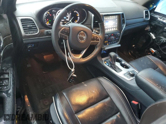 2017 Jeep Grand Cherokee Overland with VIN 1C4RJFCG4HC730861, listed as a Copart auction lot 62918825 with 77,228 mi miles and Salvage title. Bid and sale history available at DreamBid. Image 8.