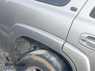 2002 Chevrolet Tahoe LS z VIN 1GNEC13Z22R197594, wystawiony jako IAAI lot #41475477 z przebiegiem 384 968 mil mil oraz . Historia ofert i sprzedaży dostępna na DreamBid. Obrazek 14.