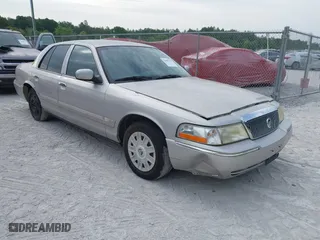 2004 Mercury Grand Marquis GS with VIN 2MEFM74W04X669087, listed as a IAAI auction lot 42090394 with 172,008 mi miles. Bid and sale history available at carsss.com. Image 1.