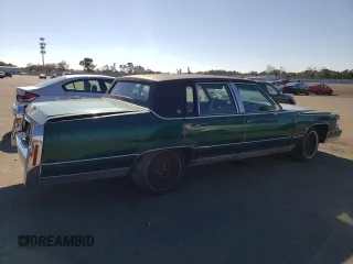 1992 Cadillac Brougham z VIN 1G6DW547XNR703499, wystawiony jako Copart lot #66709103 z przebiegiem Nie podano mil oraz Nie do naprawy. Historia ofert i sprzedaży dostępna na DreamBid. Obrazek 3.