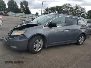2011 Honda Odyssey Touring with VIN 5FNRL5H93BB052077, listed as a Copart auction lot 64794185 with 196,887 mi miles and Salvage title. Bid and sale history available at DreamBid. Image 1.