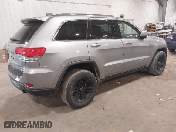 2015 Jeep Grand Cherokee Laredo with VIN 1C4RJFAG4FC797069, listed as a IAAI auction lot 41435299 with 146,755 mi miles. Bid and sale history available at carsss.com. Image 4.