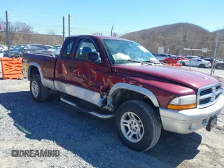 2003 Dodge Dakota SLT with VIN 1D7HG42N33S369870, listed as a IAAI auction lot 41826771 with 214,840 mi miles. Bid and sale history available at carsss.com. Image 1.
