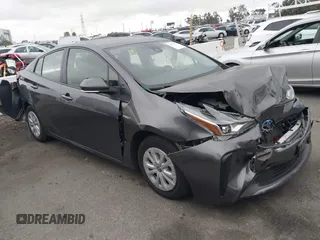2022 Toyota Prius L Eco z VIN JTDKAMFU9N3169401, wystawiony jako IAAI lot #42433420 z przebiegiem 102 566 mil mil oraz . Historia ofert i sprzedaży dostępna na DreamBid. Obrazek 1.