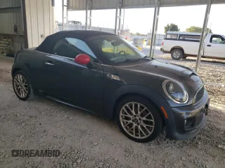 2015 MINI Roadster S z VIN WMWSY3C59FT566785, wystawiony jako Copart lot #73574064 z przebiegiem 96 623 mil mil oraz Tytuł czysty. Historia ofert i sprzedaży dostępna na DreamBid. Obrazek 4.