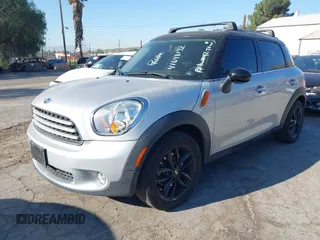 2013 MINI Countryman with VIN WMWZB3C59DWM09740, listed as a IAAI auction lot 41648192 with 145,915 mi miles and . Bid and sale history available at DreamBid. Image 2.