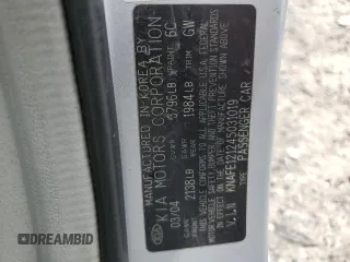 2004 Kia Spectra LX with VIN KNAFE121245031019, listed as a Copart auction lot 52960135 with 183,016 mi miles and Salvage Title. Bid and sale history available at carsss.com. Image 12.