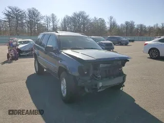 2004 Jeep Grand Cherokee Laredo z VIN 1J4GW48S74C159381, wystawiony jako Copart lot #53972115 z przebiegiem 128 309 mil mil oraz Szkoda całkowita • Salvage title. Historia ofert i sprzedaży dostępna na DreamBid. Obrazek 14.