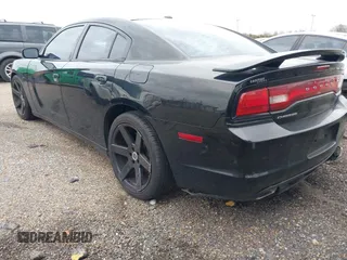 2013 Dodge Charger SXT with VIN 2C3CDXHG2DH558465, listed as a IAAI auction lot 41563714 with 151,052 mi miles. Bid and sale history available at carsss.com. Image 3.