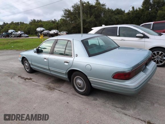 1996 Mercury Grand Marquis GS with VIN 2MELM74W5TX653873, listed as a Copart auction lot 74659254 with 86,589 mi miles and Salvage Title. Bid and sale history available at DreamBid. Image 2.