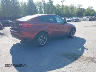 2014 BMW X6 xDrive35i z VIN 5UXFG2C57E0C44052, wystawiony jako IAAI lot #40231766 z przebiegiem 131 573 mil mil oraz . Historia ofert i sprzedaży dostępna na DreamBid. Obrazek 4.